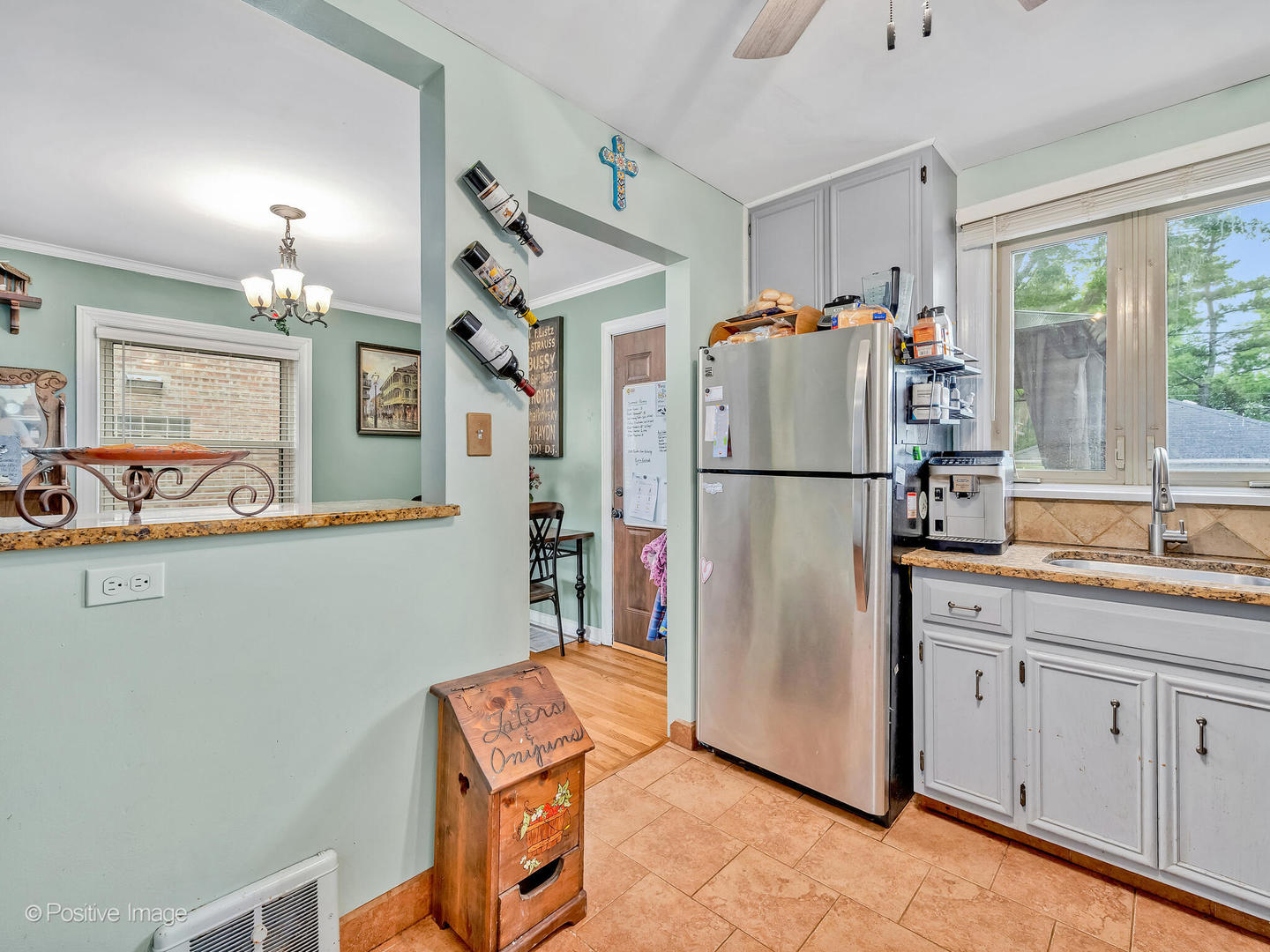 4154 Elm Avenue Brookfield, IL 60513 - Photo 4 of 20 a kitchen with stainless steel appliances granite countertop a refrigerator a sink and a stove