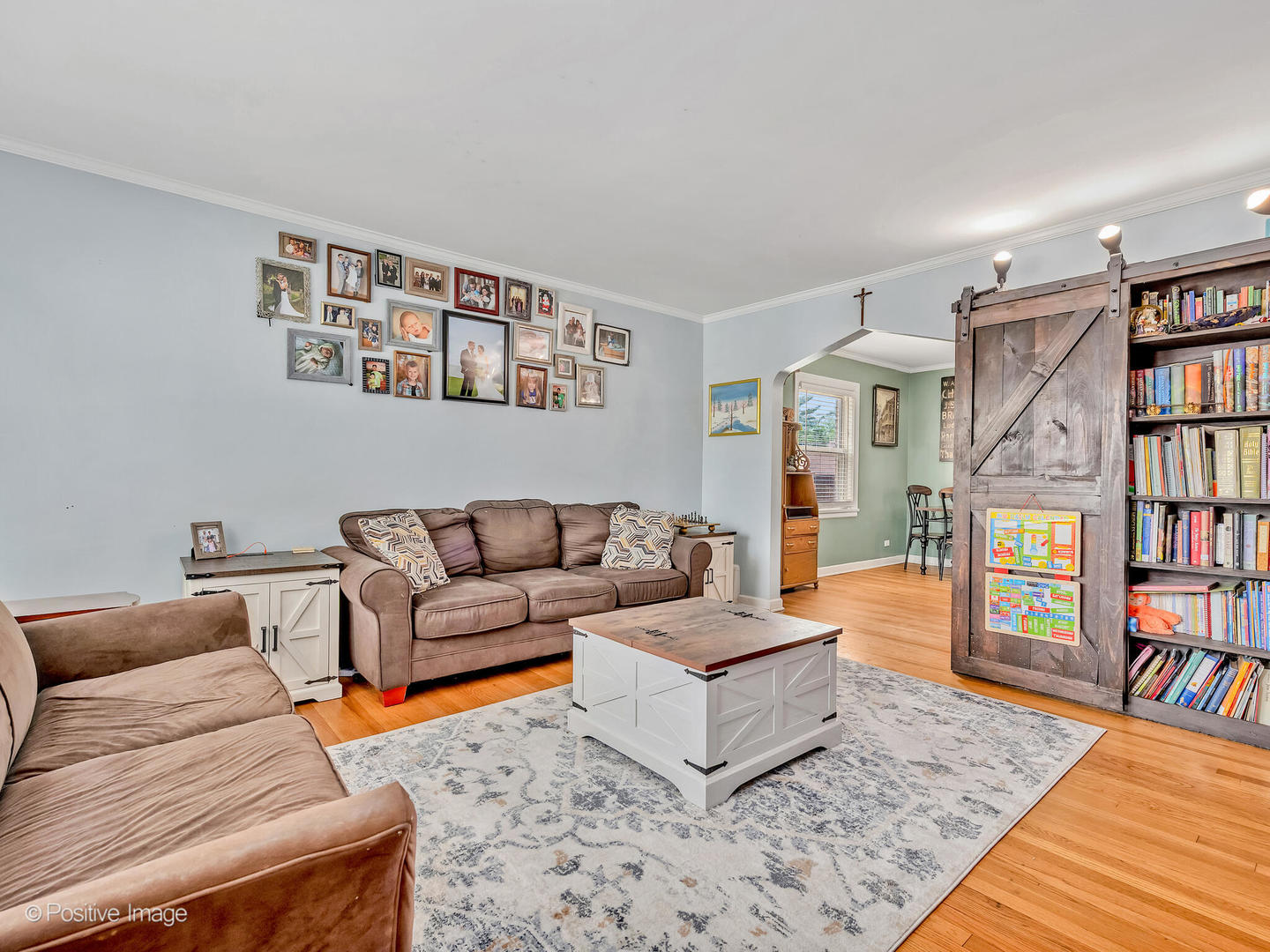 4154 Elm Avenue Brookfield, IL 60513 - Photo 8 of 20 a living room with furniture and a book shelf