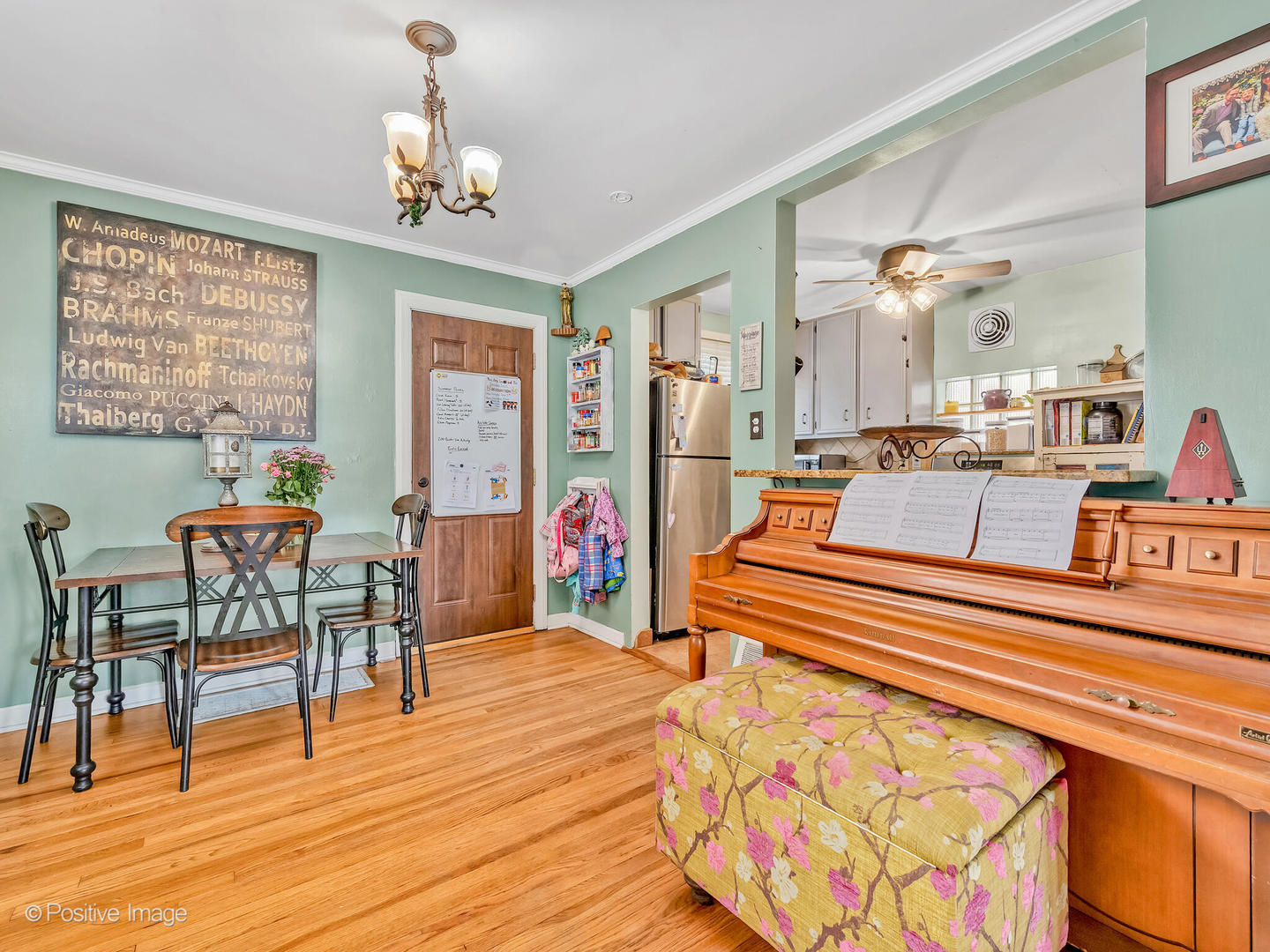 4154 Elm Avenue Brookfield, IL 60513 - Photo 10 of 20 a living room with furniture a dining table and a bookshelf with wooden floor
