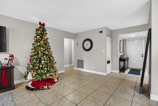 a living room with a christmas tree