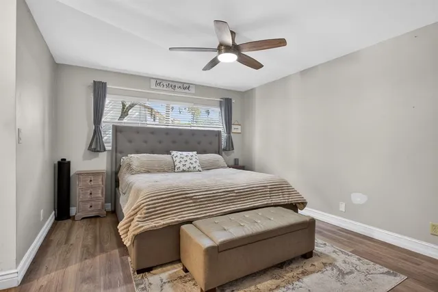 a bedroom with a bed and window