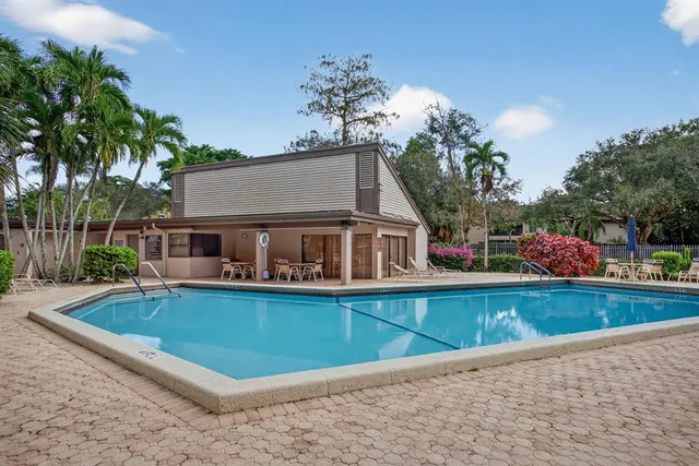 a front view of house with yard and outdoor seating