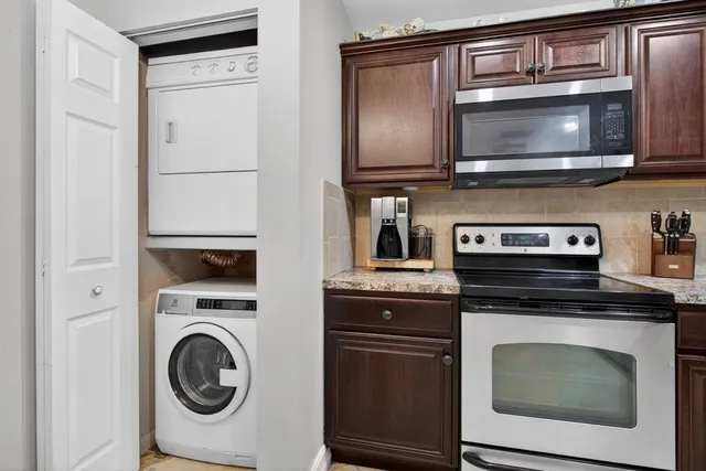 a kitchen with a stove and a microwave