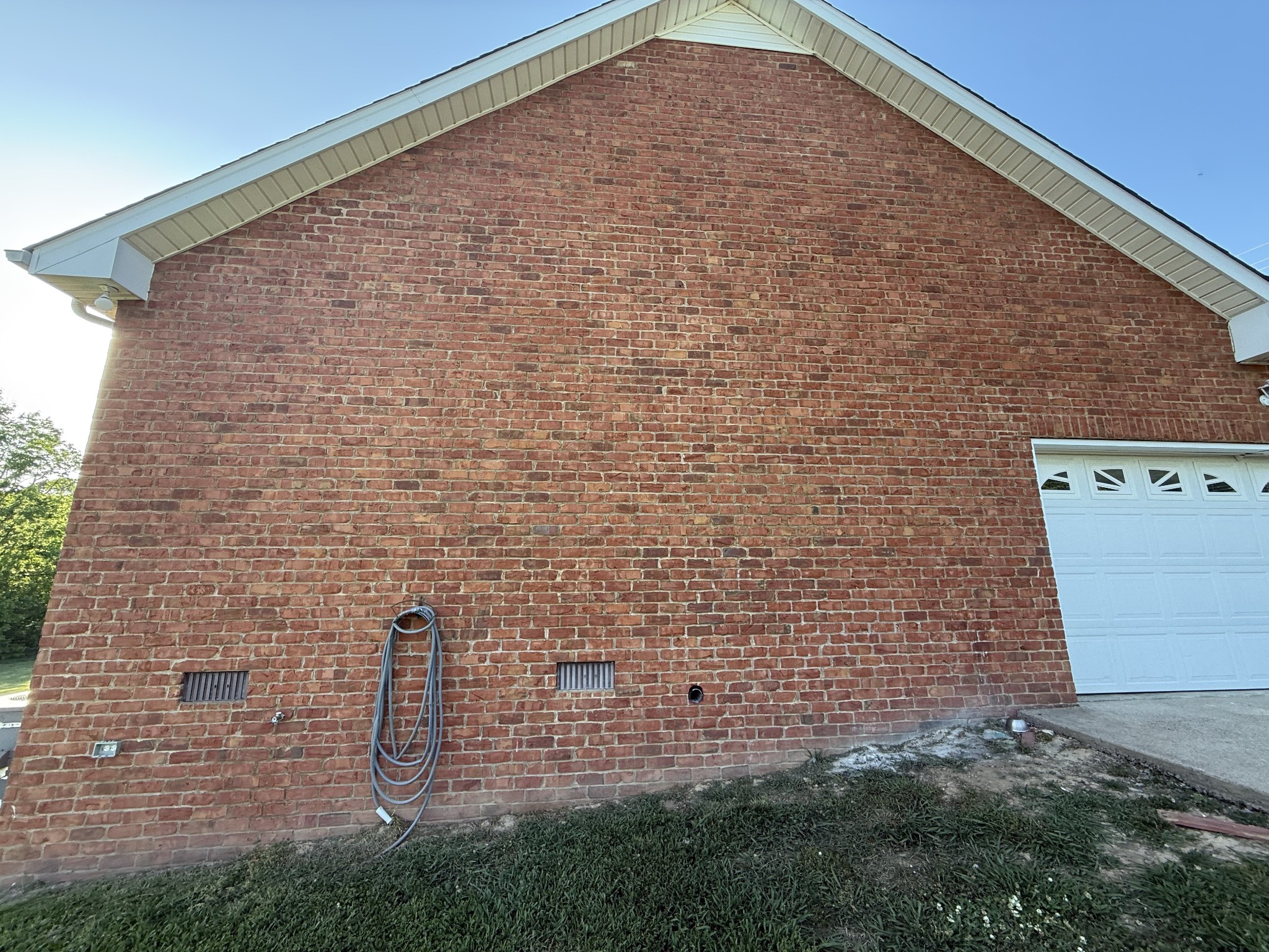 1702 Abiff Road Burns, TN 37029 - Photo 6 of 47 a brick building with a yard