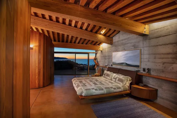 a view of a backyard with a tub and wooden floor