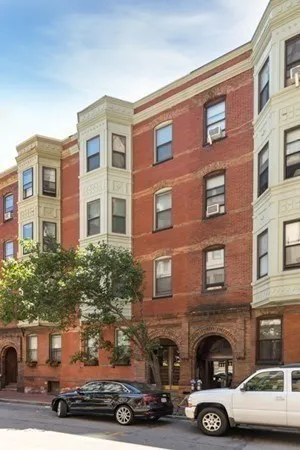 a car parked in front of a building