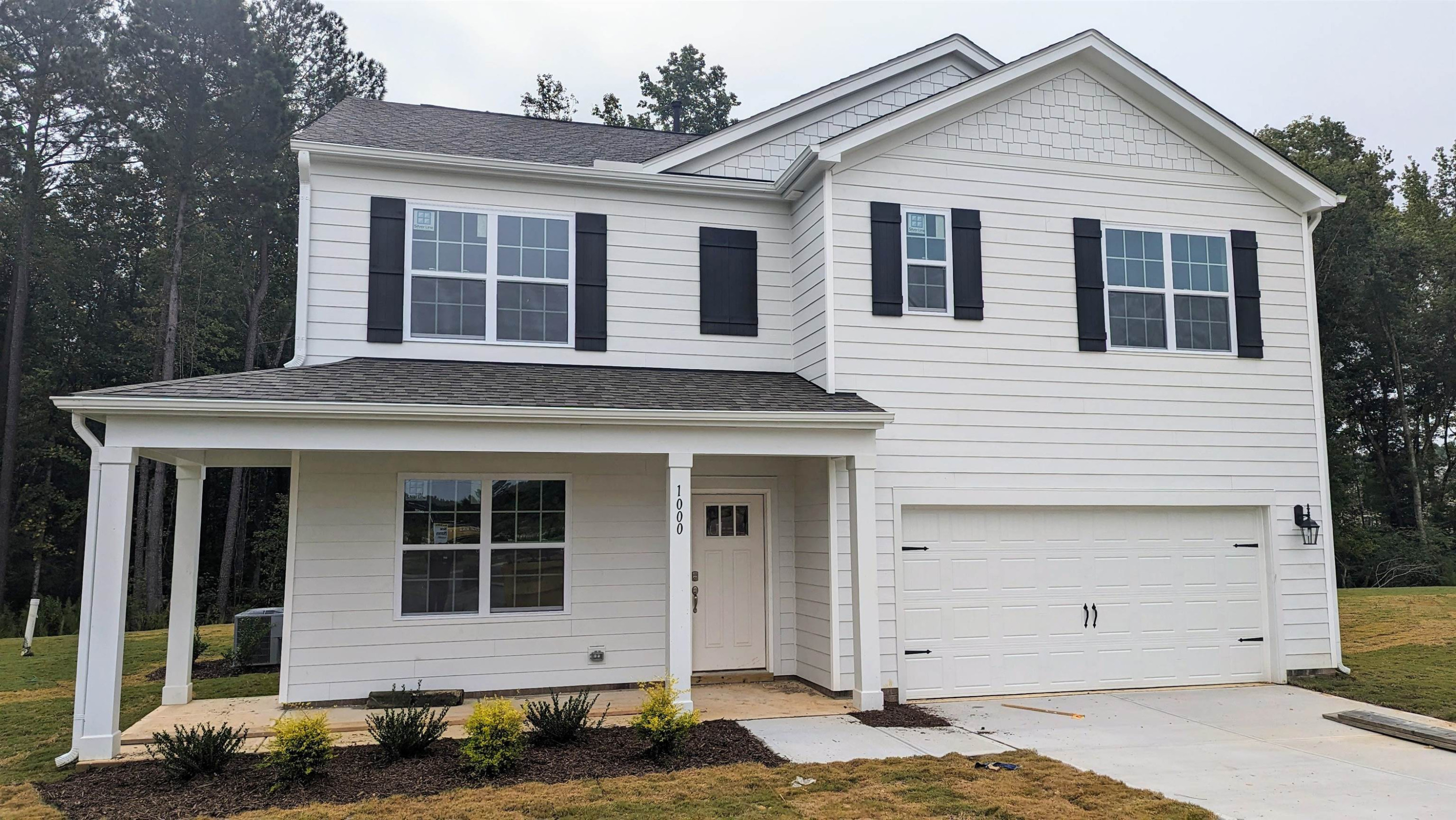 1000 Octans Way Wendell, NC 27591 - Photo 1 of 41 a view of a white house with large windows next to a yard