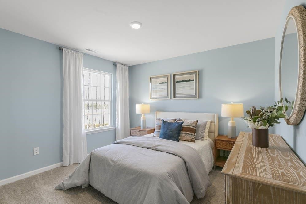 1000 Octans Way Wendell, NC 27591 - Photo 23 of 41 a bedroom with a bed and window