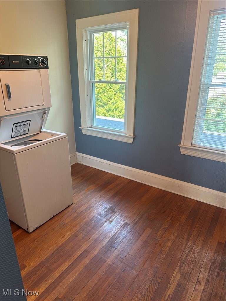 5452 Woodside Road Mentor, OH 44060 - Photo 17 of 19 Laundry area featuring hardwood / wood-style flooring, plenty of natural light, and stacked washing machine and dryer