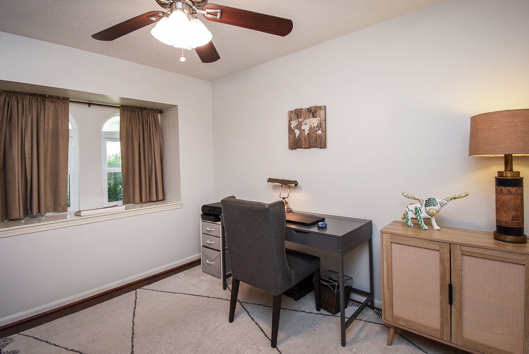 2930 Kevin Lane Houston, TX 77080 - Photo 22 of 50 The room features a ceiling fan and neutral décor, creating a comfortable and functional workspace/ office/formal dining or living.