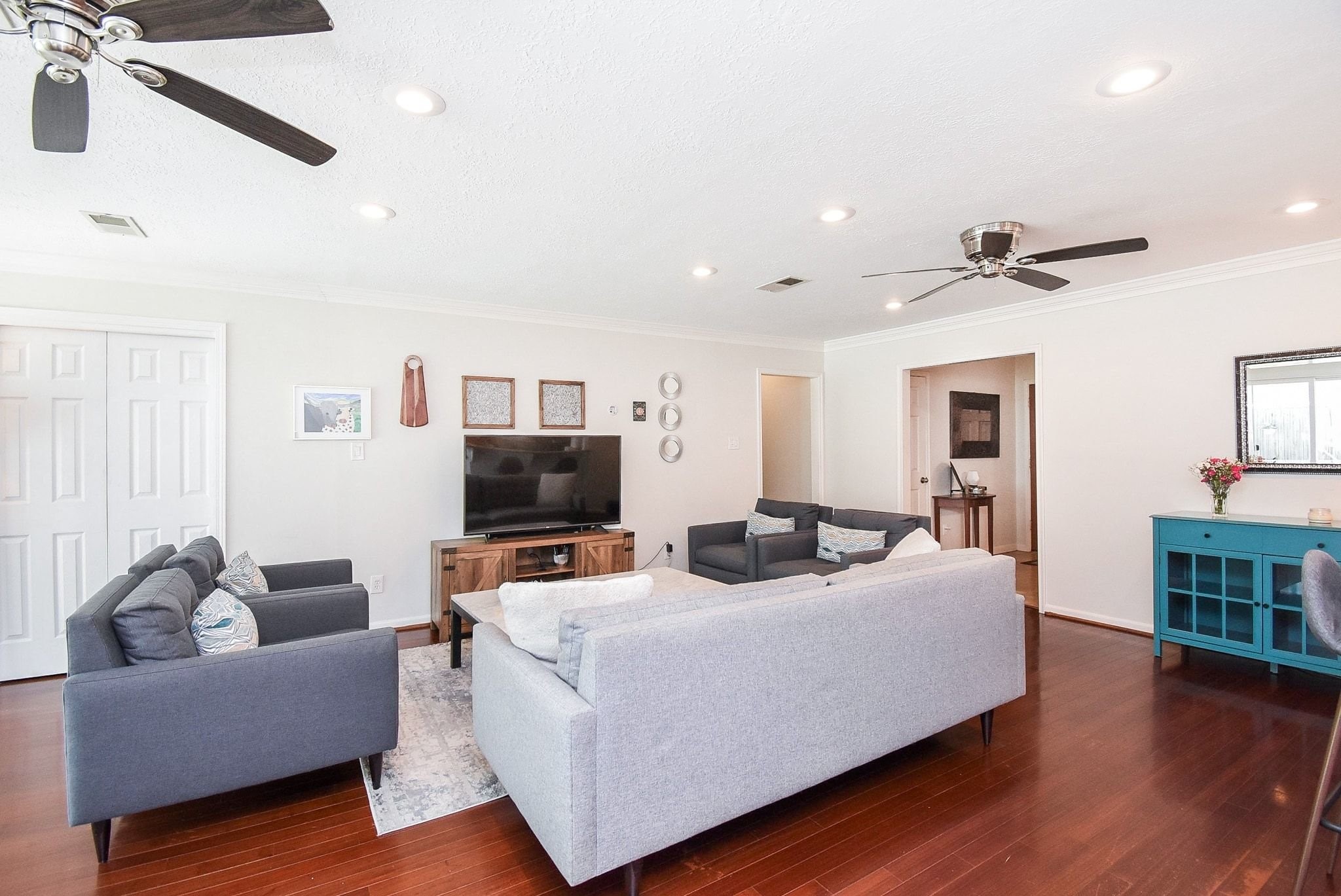 2930 Kevin Lane Houston, TX 77080 - Photo 25 of 50 Bright and spacious living room with hardwood floors, recessed lighting, and ceiling fans. Ideal for comfortable family gatherings.