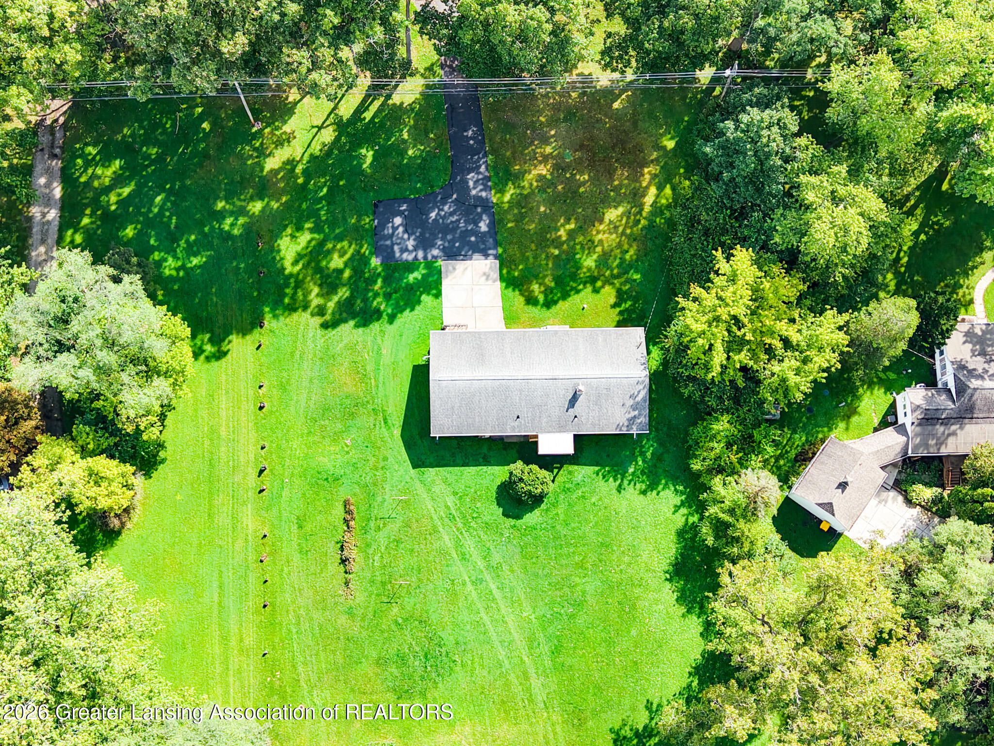 4497 Meridian Road Okemos, MI 48864 - Photo 54 of 58 DJI_20260910113854_0039_D