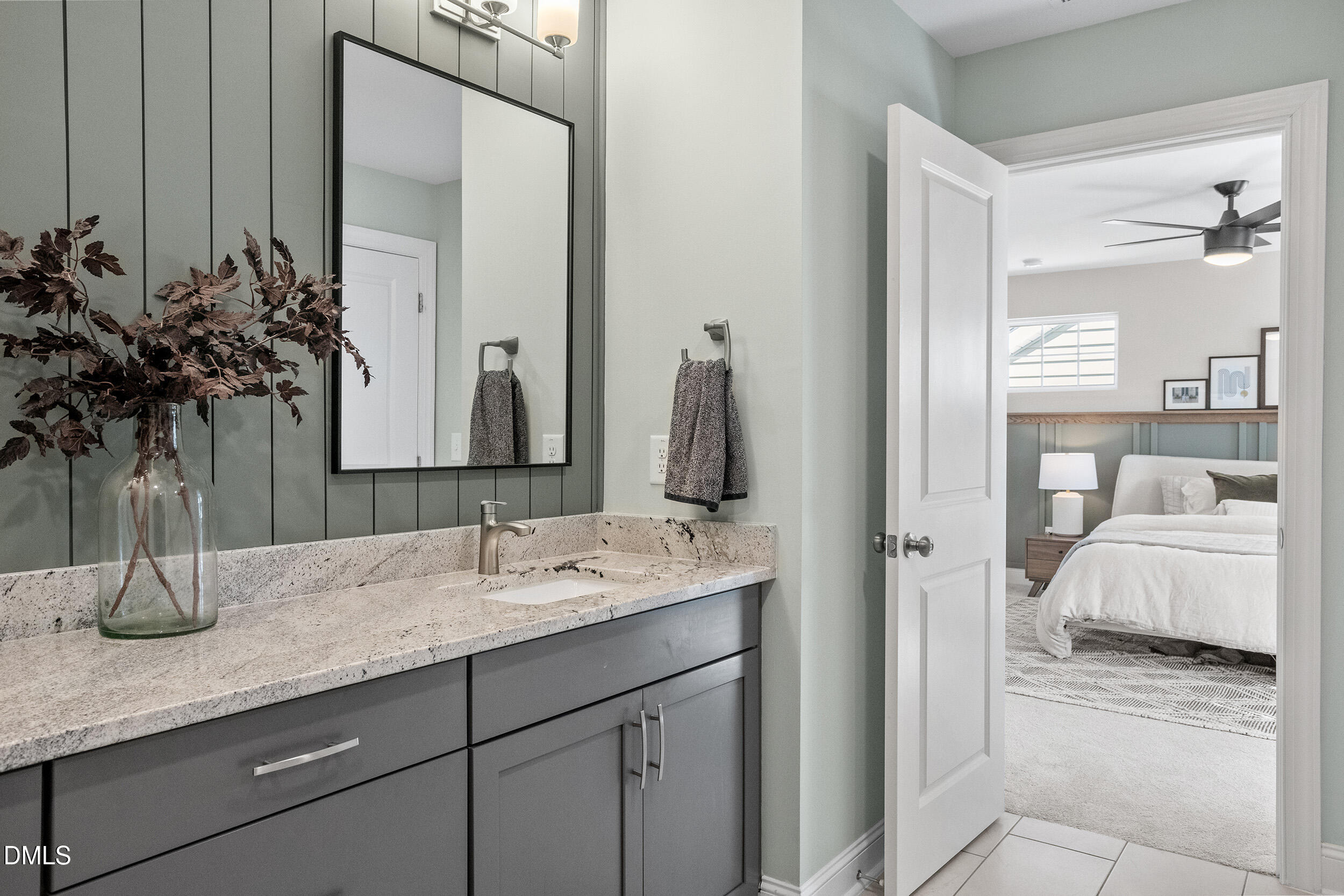 1602 Farm Pond Trail Durham, NC 27703 - Photo 23 of 43 a en suite bathroom with a double vanity sink and a mirror