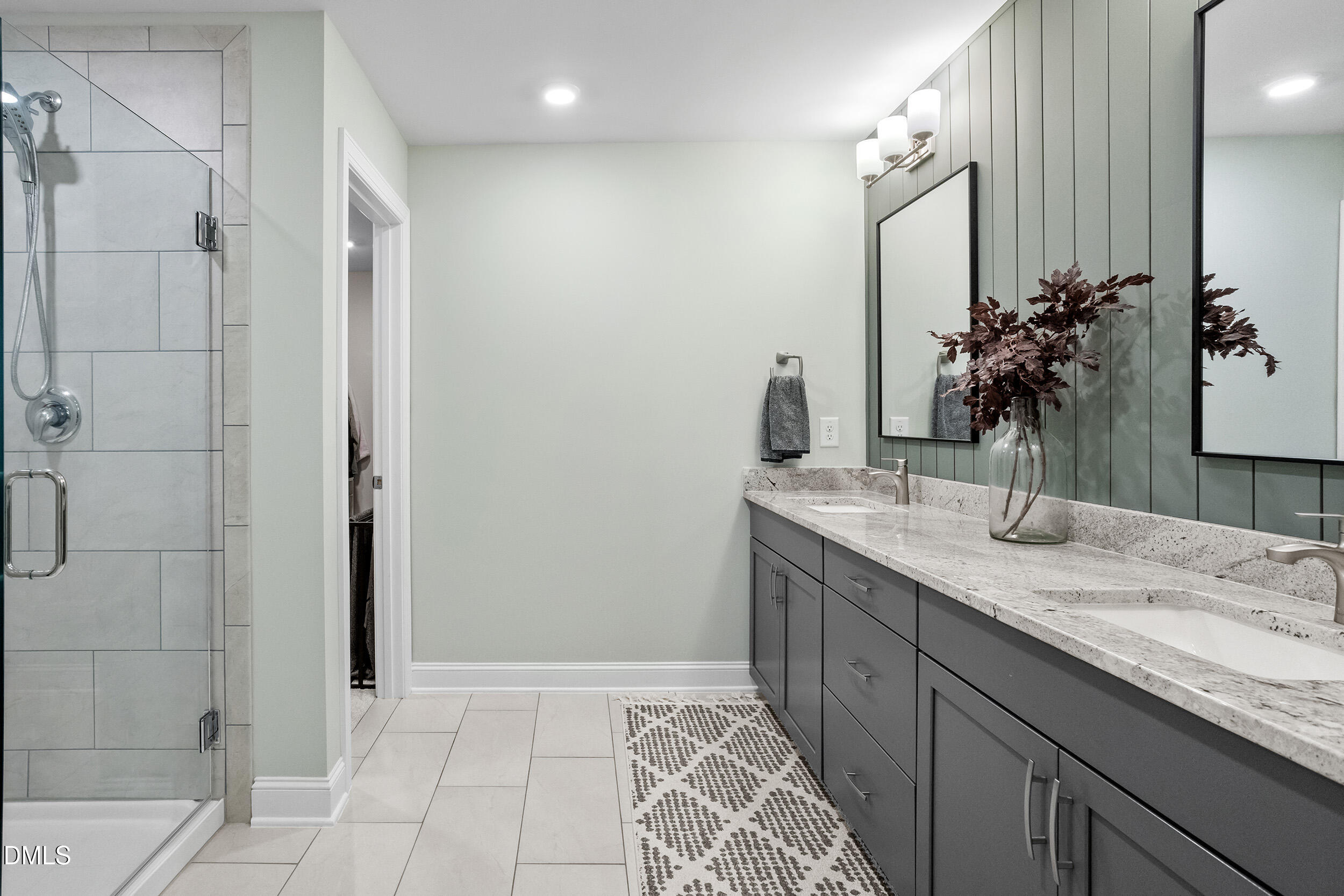 1602 Farm Pond Trail Durham, NC 27703 - Photo 24 of 43 a bathroom with a granite countertop sink a mirror and a shower
