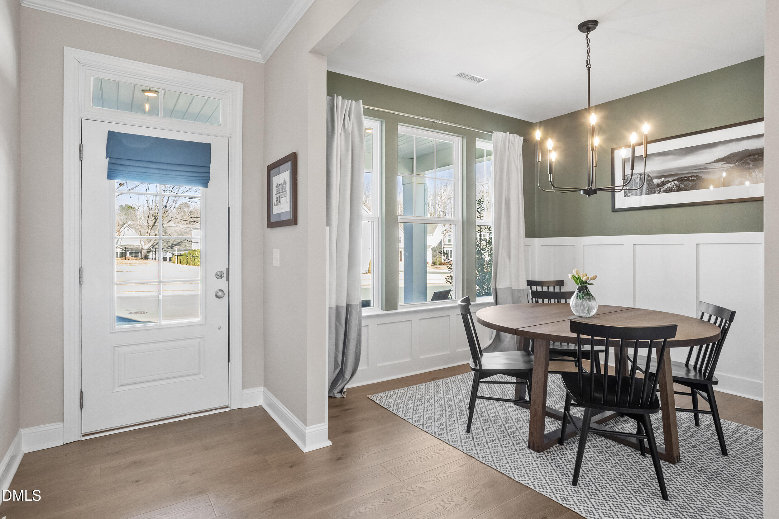 1602 Farm Pond Trail Durham, NC 27703 - Photo 4 of 43 a view of a dining room with furniture window and wooden floor