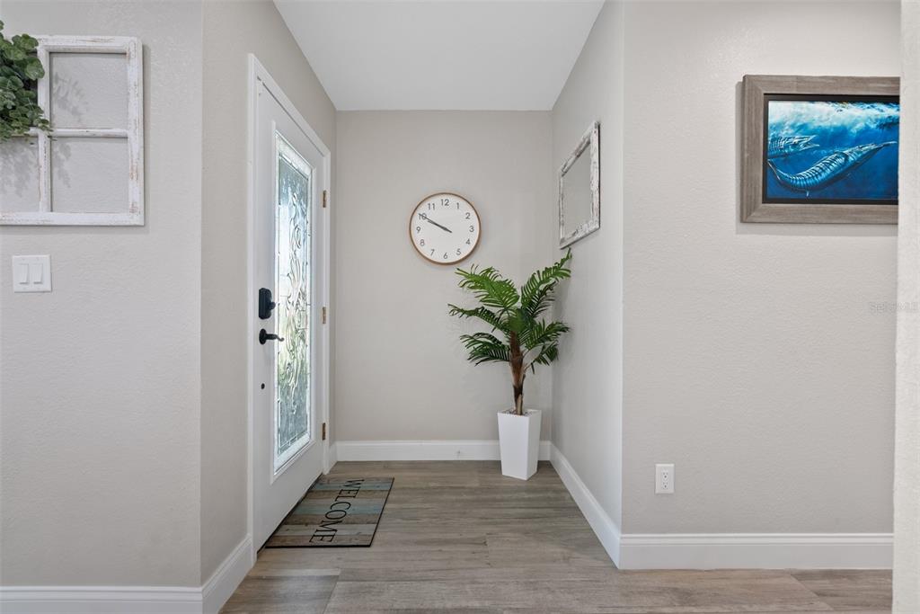 3422 West Shell Point Road Ruskin, FL 33570 - Photo 4 of 54 a view of entryway with wooden floor