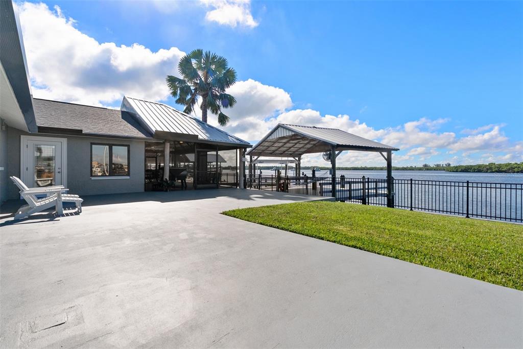 3422 West Shell Point Road Ruskin, FL 33570 - Photo 43 of 54 a view of a house with backyard and porch