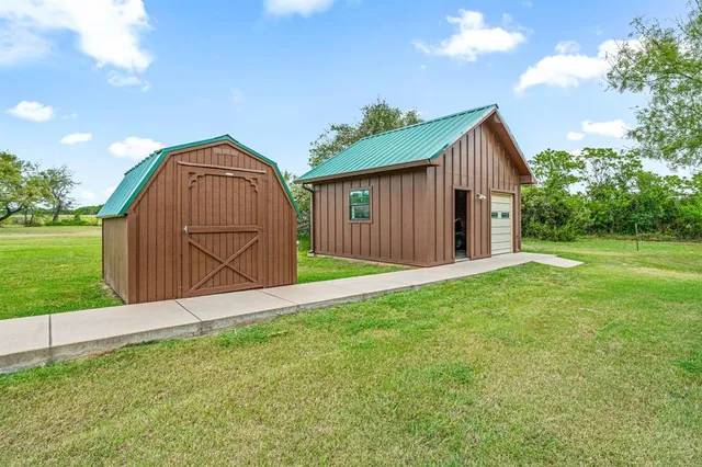 a view of backyard with green space