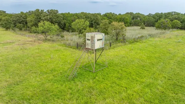 a view of a lake with a yard