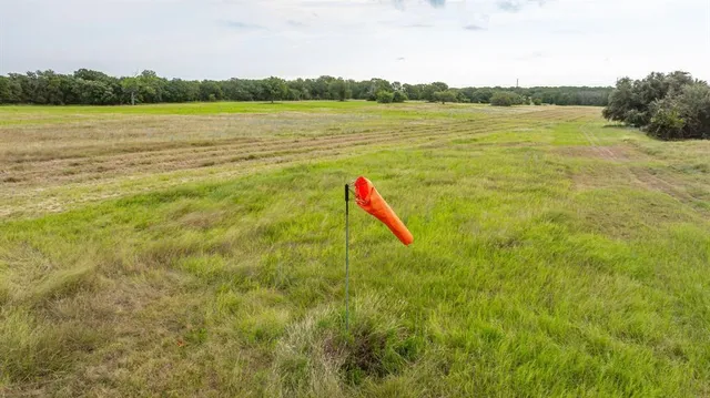 a view of a lake with a yard