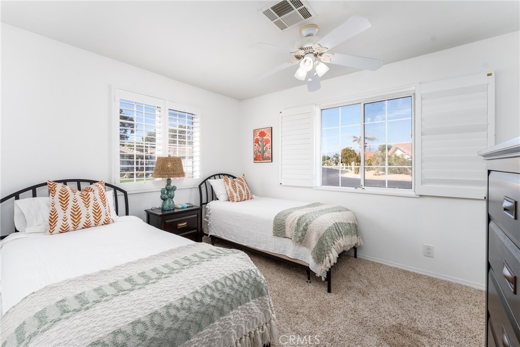 48330 Mamie Way Indio, CA 92201 - Photo 36 of 46 a bedroom with two beds and a window
