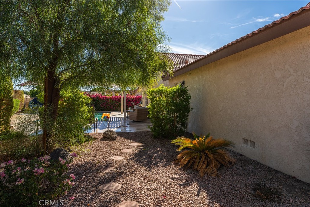 48330 Mamie Way Indio, CA 92201 - Photo 42 of 46 a backyard of a house with outdoor seating