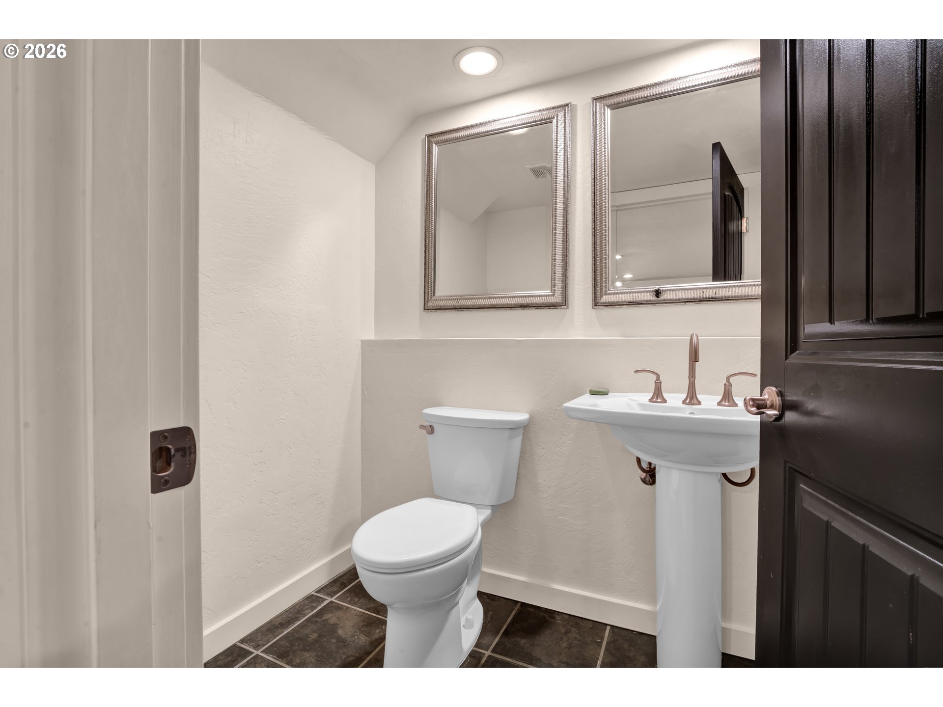 947 South R Street Cottage Grove, OR 97424 - Photo 21 of 48 a bathroom with a sink a toilet and mirror