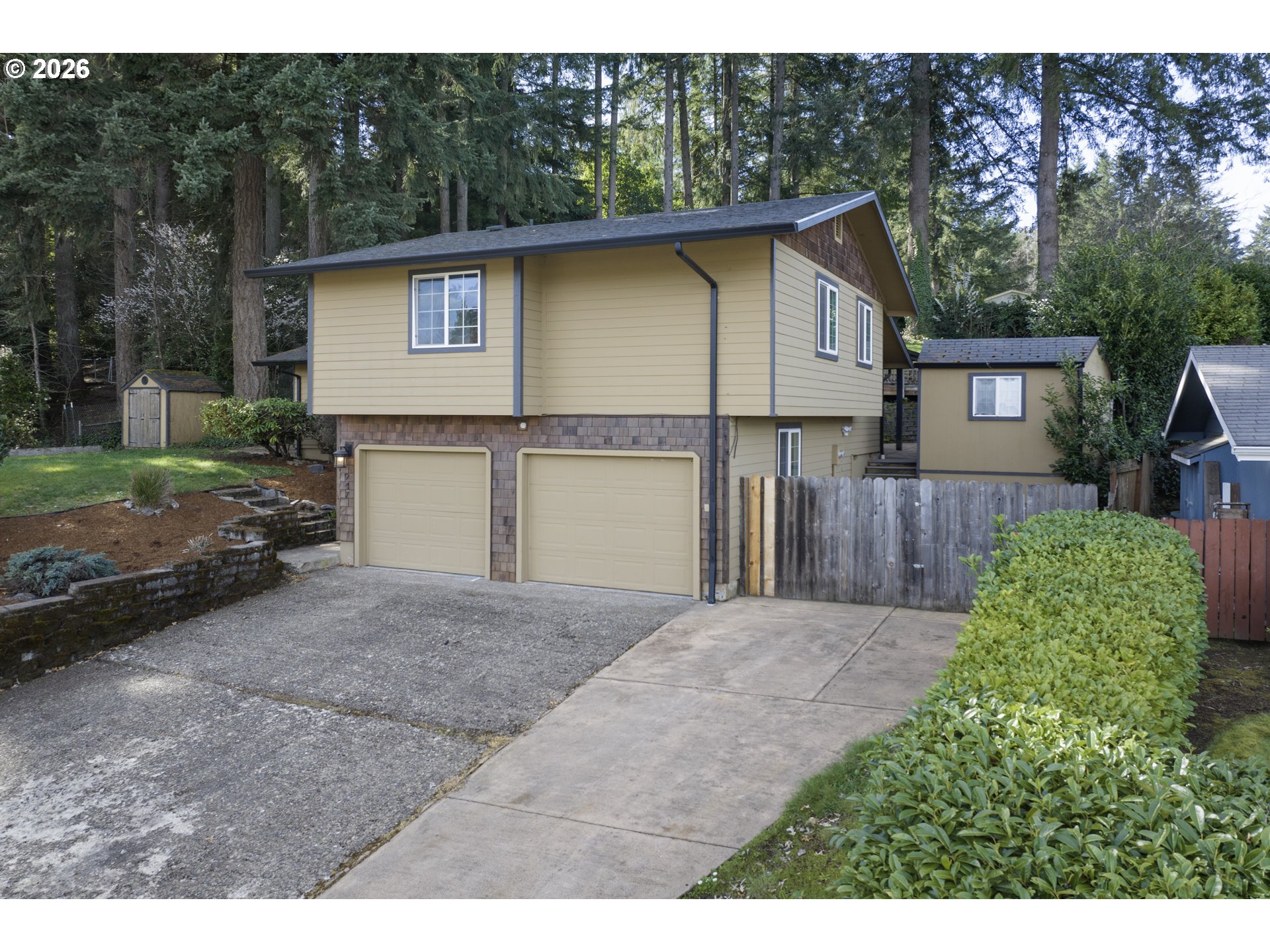 947 South R Street Cottage Grove, OR 97424 - Photo 5 of 48 a front view of a house with a yard and garage