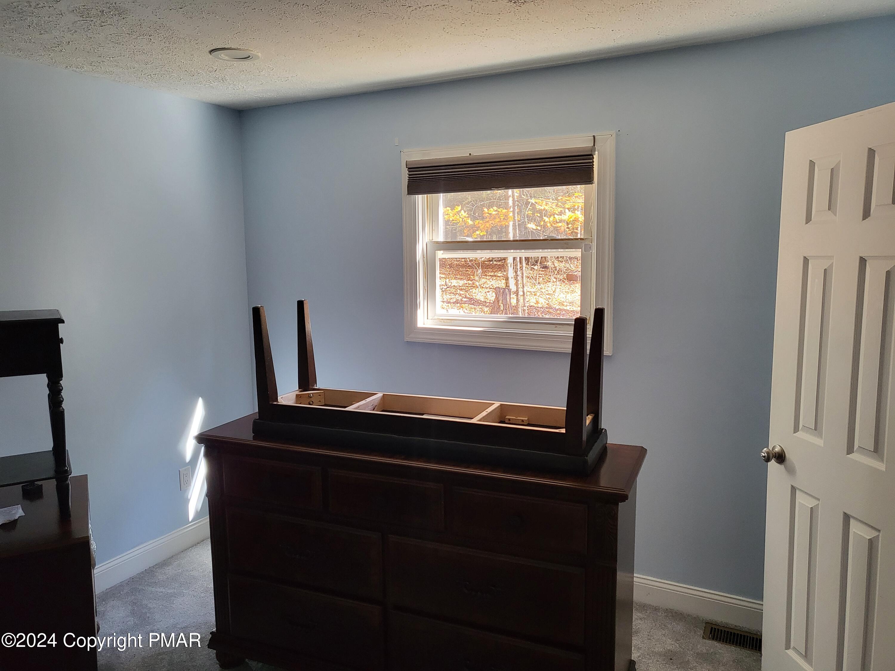 191 Sportsmen Drive Cresco, PA 18326 - Photo 14 of 29 a room with a window and a mirror