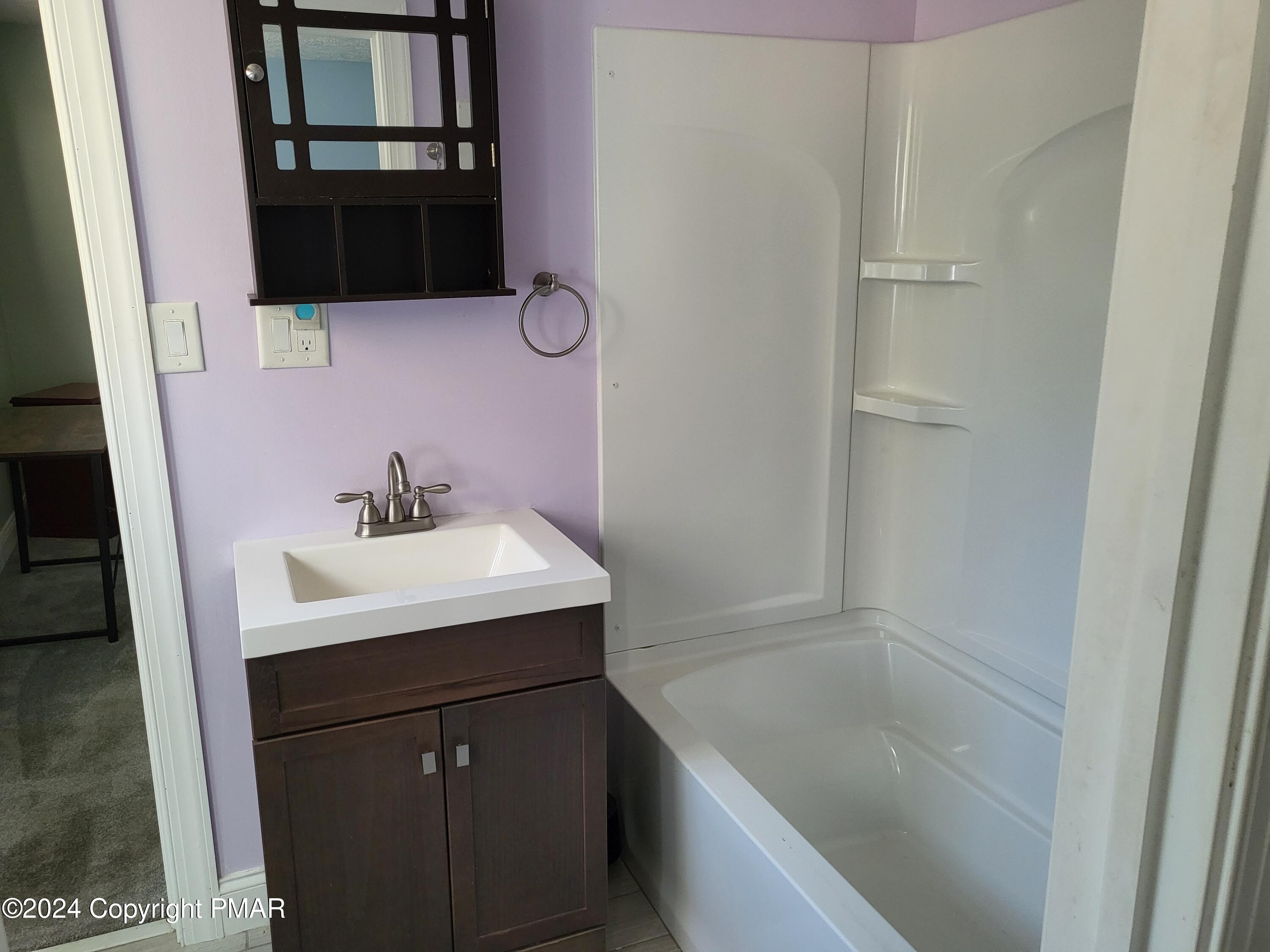 191 Sportsmen Drive Cresco, PA 18326 - Photo 17 of 29 a bathroom with a sink and a mirror