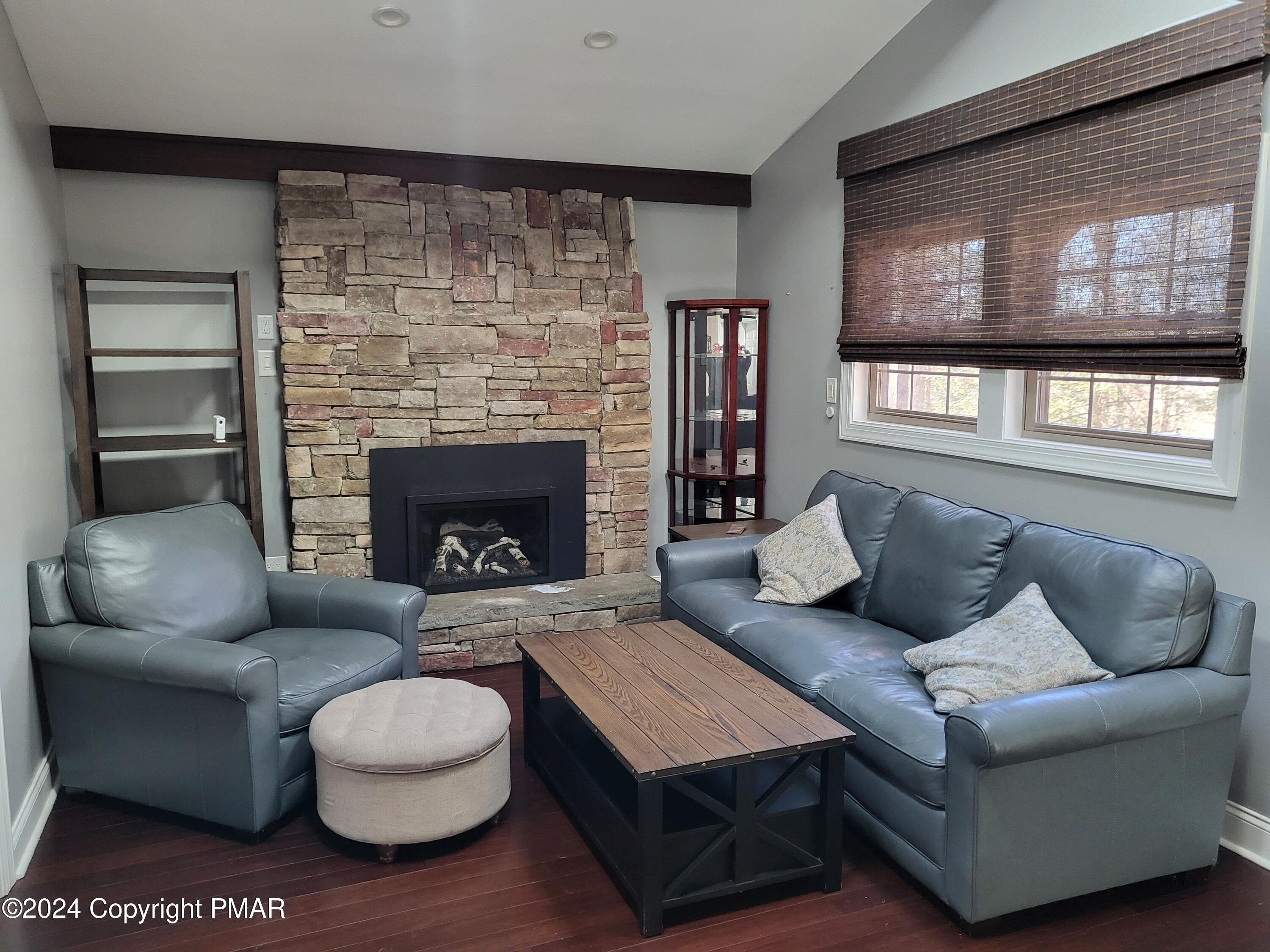 191 Sportsmen Drive Cresco, PA 18326 - Photo 2 of 29 a living room with furniture and a fireplace