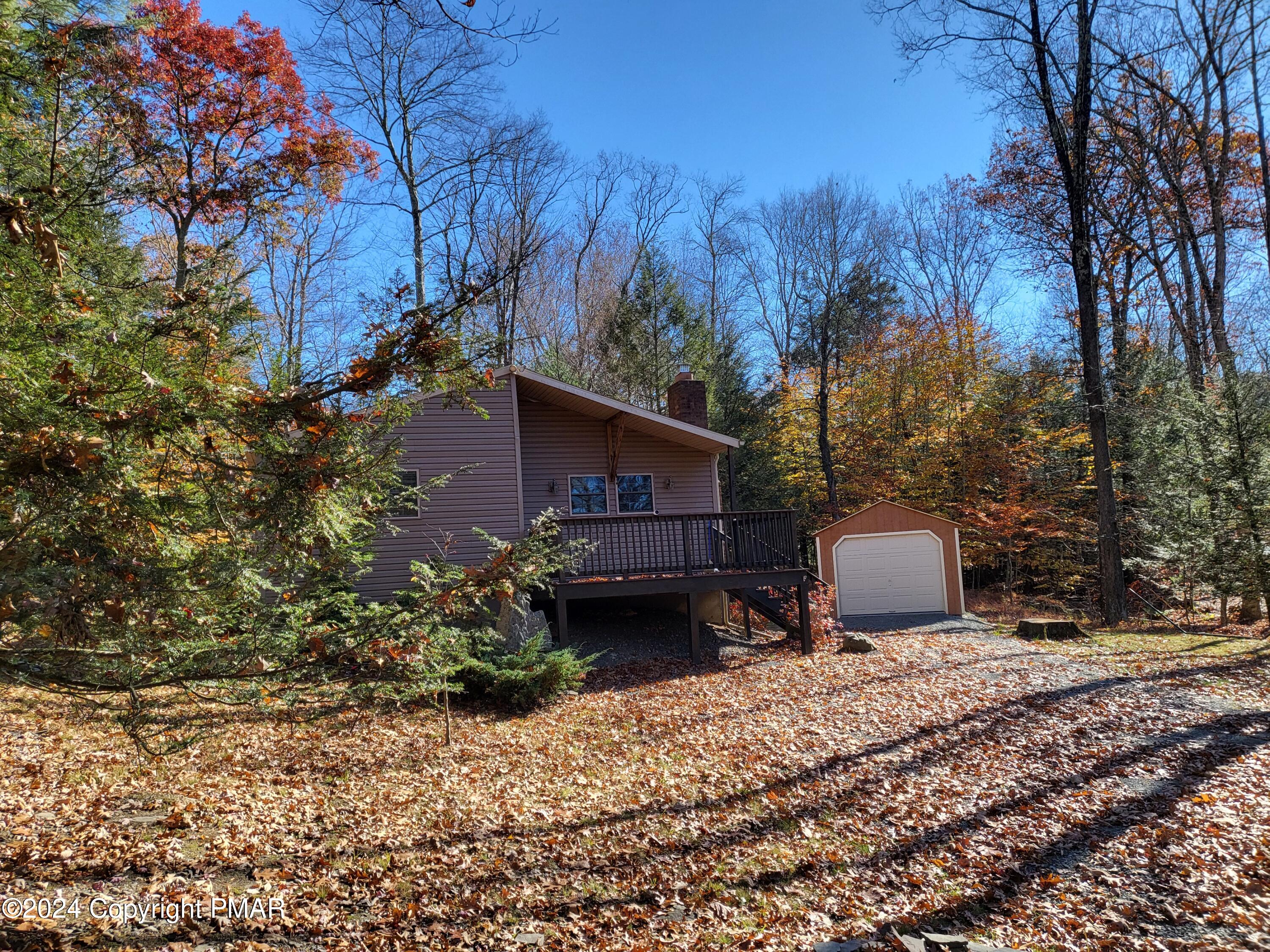 191 Sportsmen Drive Cresco, PA 18326 - Photo 25 of 29 a view of a house with a yard and sitting area