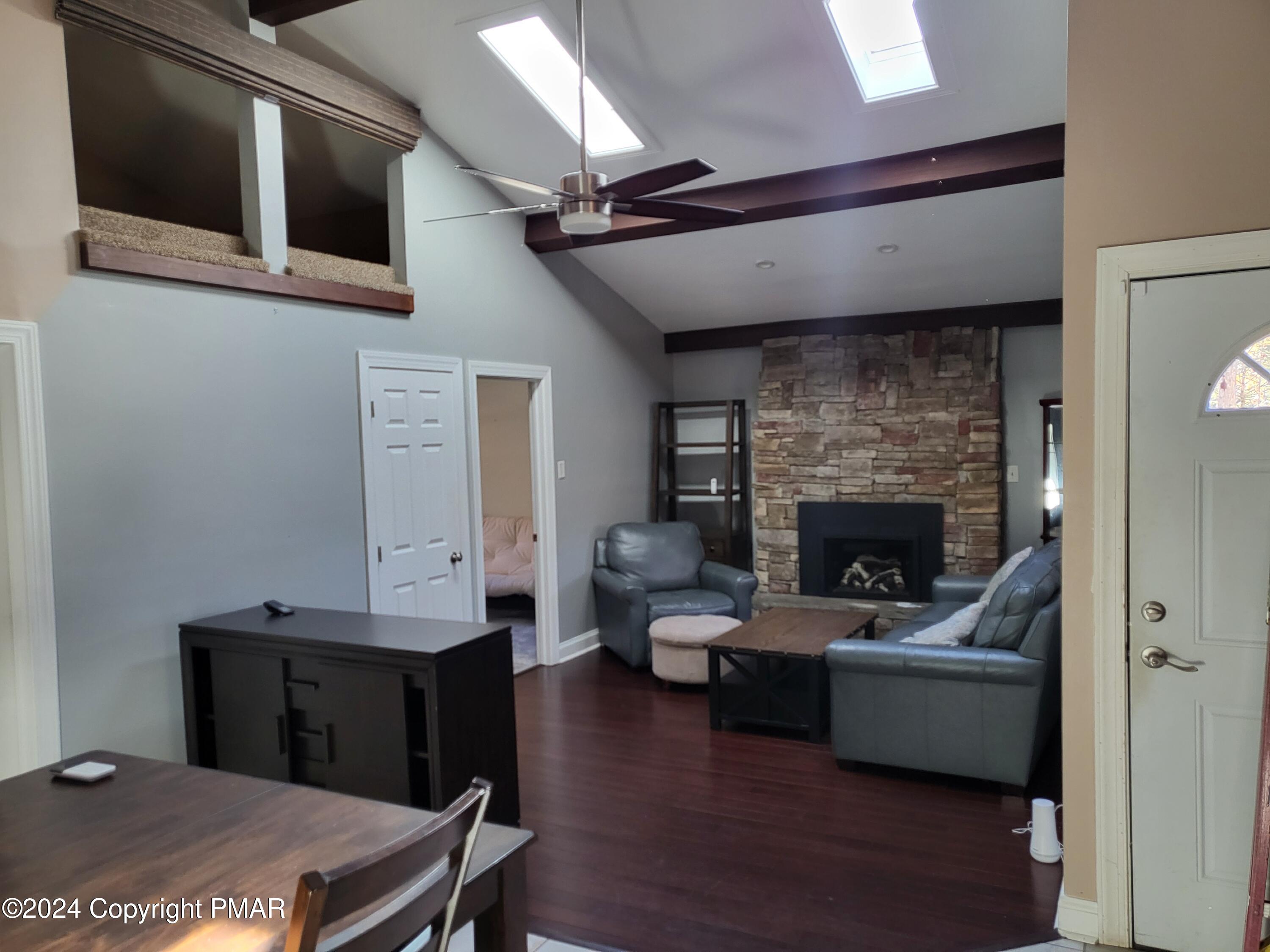 191 Sportsmen Drive Cresco, PA 18326 - Photo 3 of 29 a living room with furniture and a fireplace