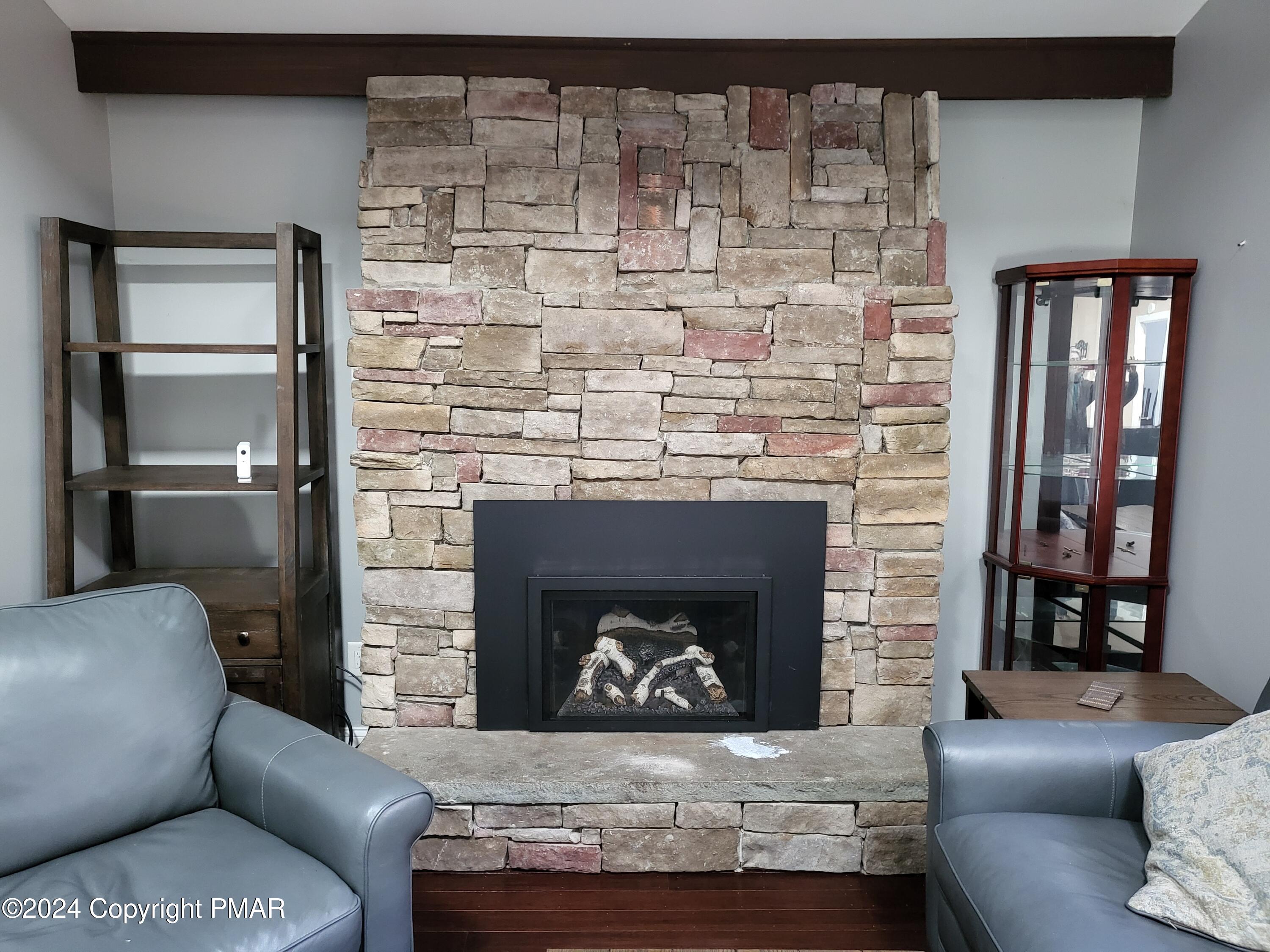 191 Sportsmen Drive Cresco, PA 18326 - Photo 4 of 29 a living room with furniture and a fireplace