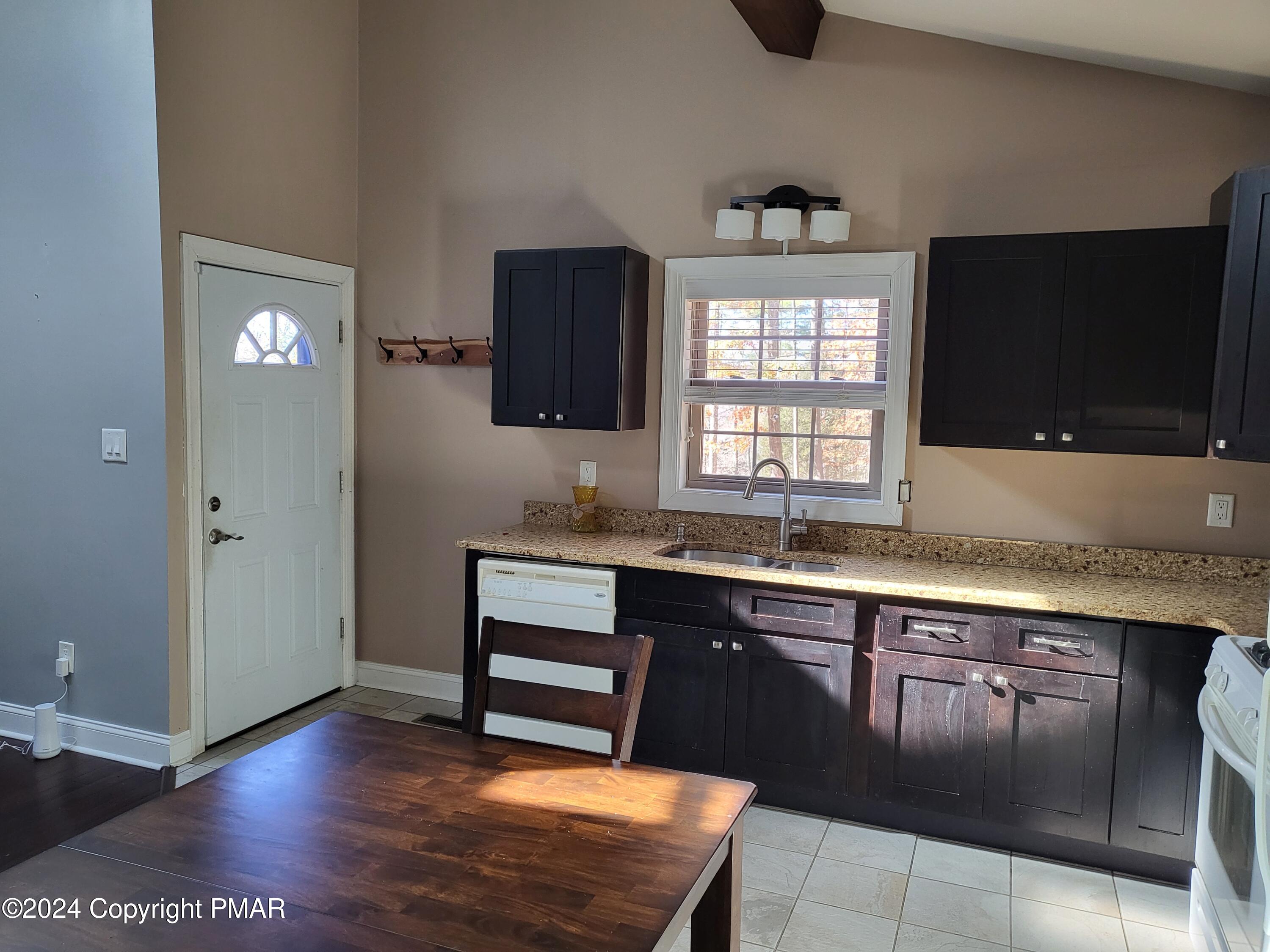 191 Sportsmen Drive Cresco, PA 18326 - Photo 5 of 29 a kitchen with stainless steel appliances granite countertop a stove a sink and a microwave