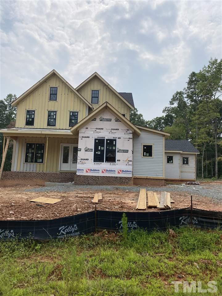 2221 Duskywing Drive Raleigh, NC 27613 - Photo 2 of 3 a front view of a house with a yard