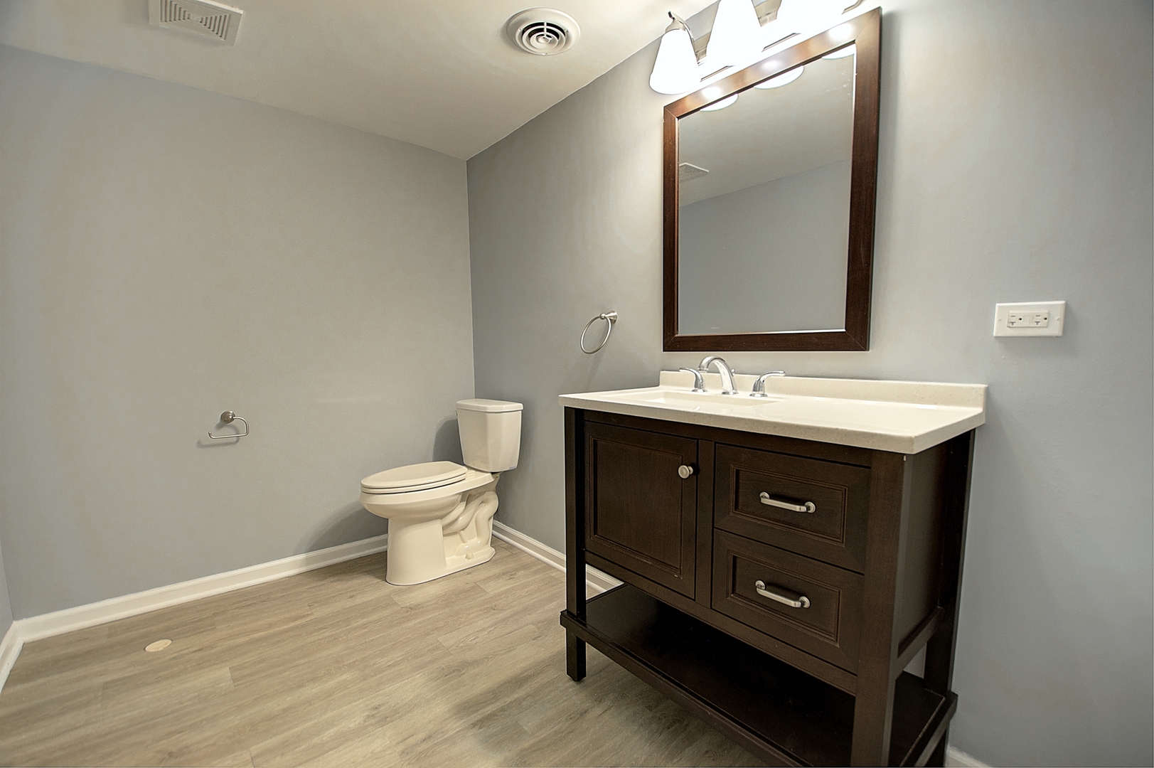 1407 Birch Road Homewood, IL 60430 - Photo 13 of 13 a bathroom with a toilet a sink and mirror