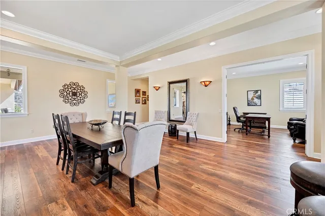 a living room with kitchen island furniture and a kitchen view