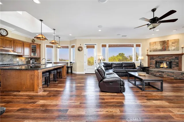 a kitchen with stainless steel appliances granite countertop a sink and a cabinets