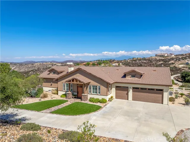 a view of a terrace with furniture and city view