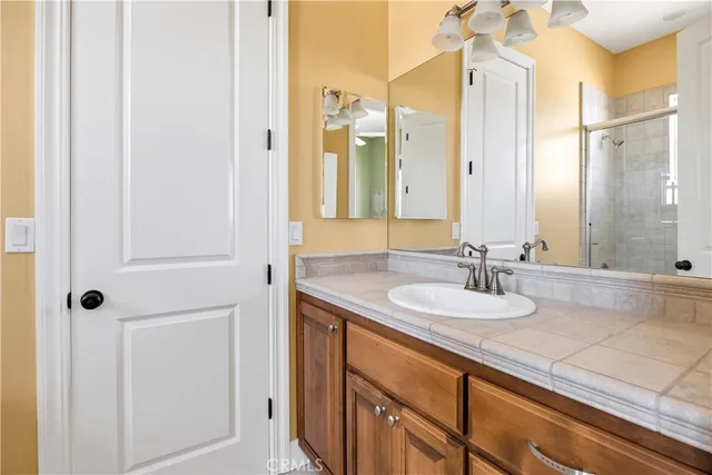 a view of a patio with chair and flower pot