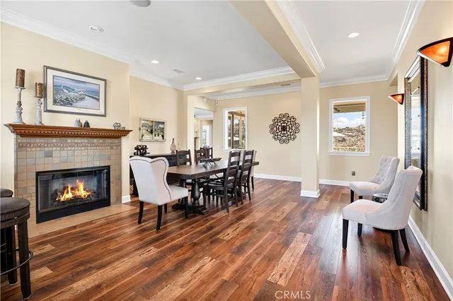 a dining room with furniture and wooden floor