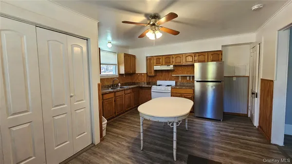 a kitchen with a refrigerator a sink and dishwasher