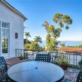 a view of a chairs and table in patio