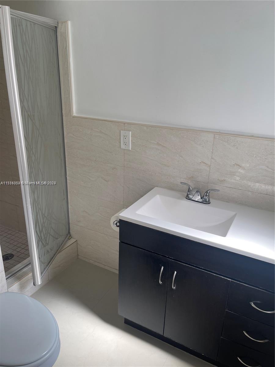 Keystone Point North Miami, FL 33181 - Photo 6 of 14 a bathroom with a sink and mirror