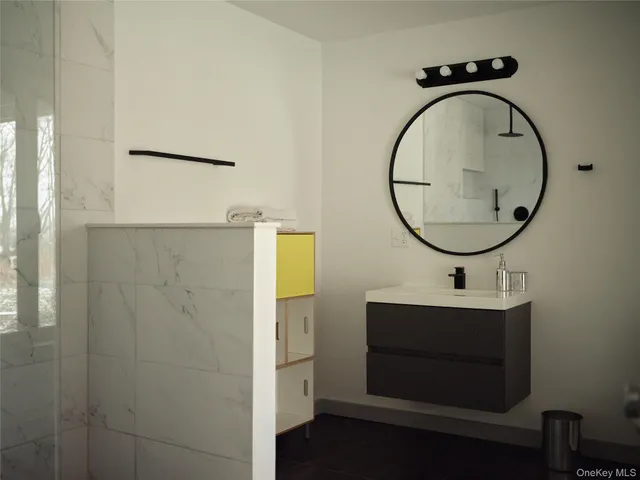 a bathroom with a sink and a mirror
