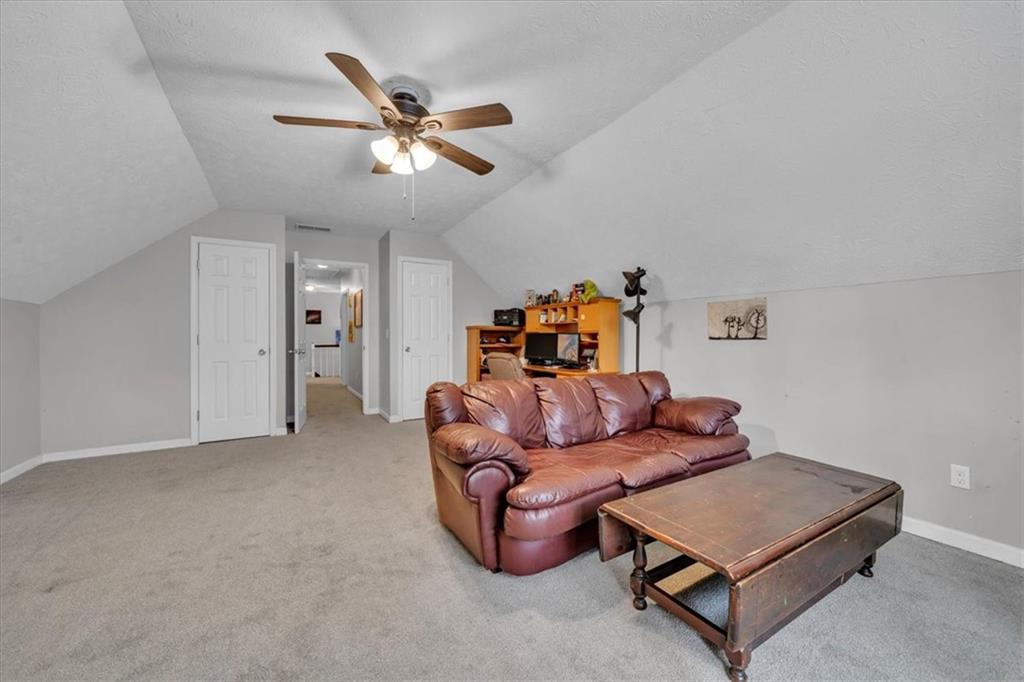 3410 Pilot Road Covington, GA 30014 - Photo 33 of 66 a living room with furniture and a ceiling fan