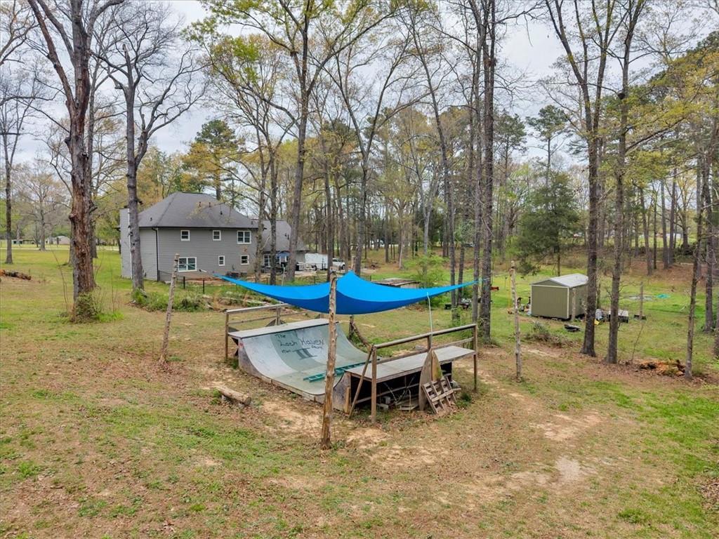 3410 Pilot Road Covington, GA 30014 - Photo 39 of 66 a backyard of a house with swimming pool and outdoor seating