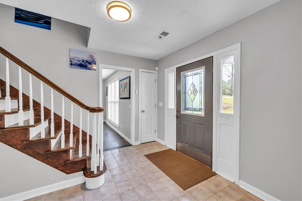 3410 Pilot Road Covington, GA 30014 - Photo 4 of 66 a view of entryway and hall with wooden floor