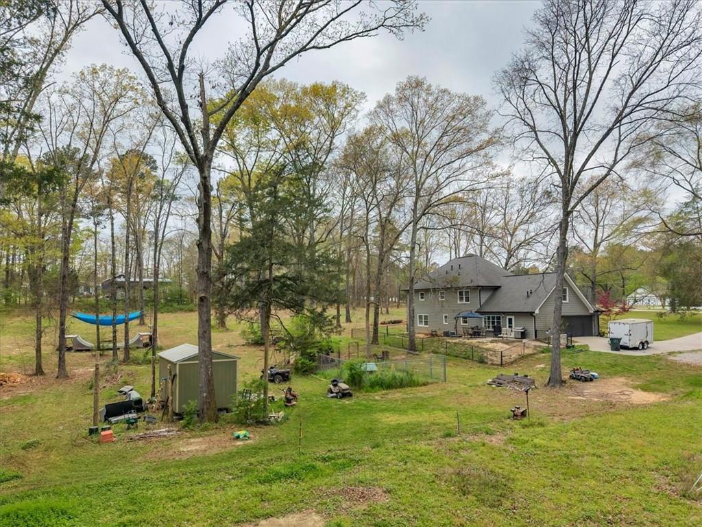 3410 Pilot Road Covington, GA 30014 - Photo 44 of 66 a view of yard with swimming pool and trees